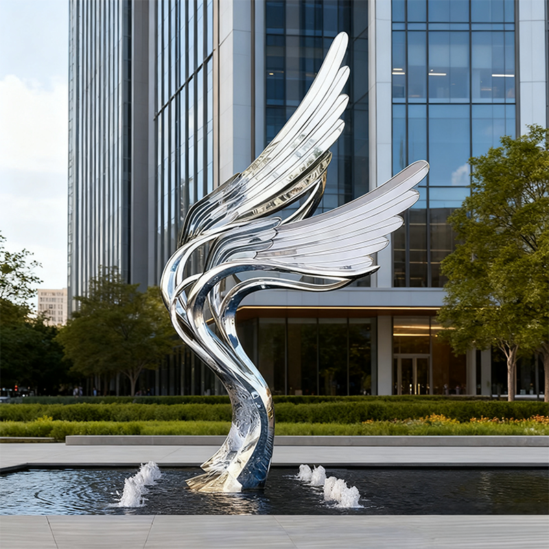 Escultura de elemento acuático de ala de espejo de alas en vuelo