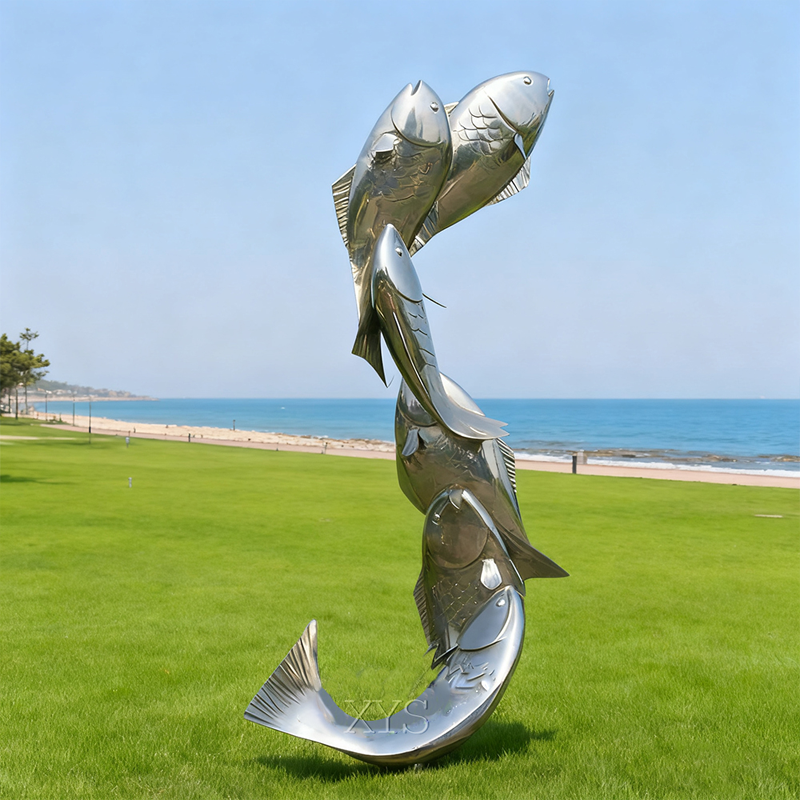 Escultura de fuente de agua con espejo de escuela de peces saltadores