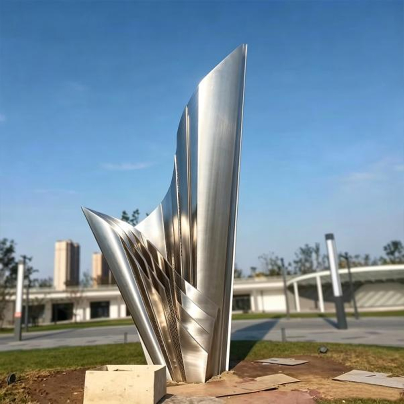 Escultura de vela de acero inoxidable cepillado
